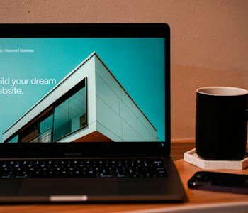 Laptop workspace used for compliance review